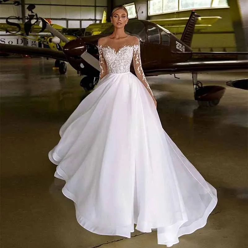 A-line Princess Boho Bridal Dress Long Sleeves Scoop Neck Covered Button Wedding Dress With Appliqued