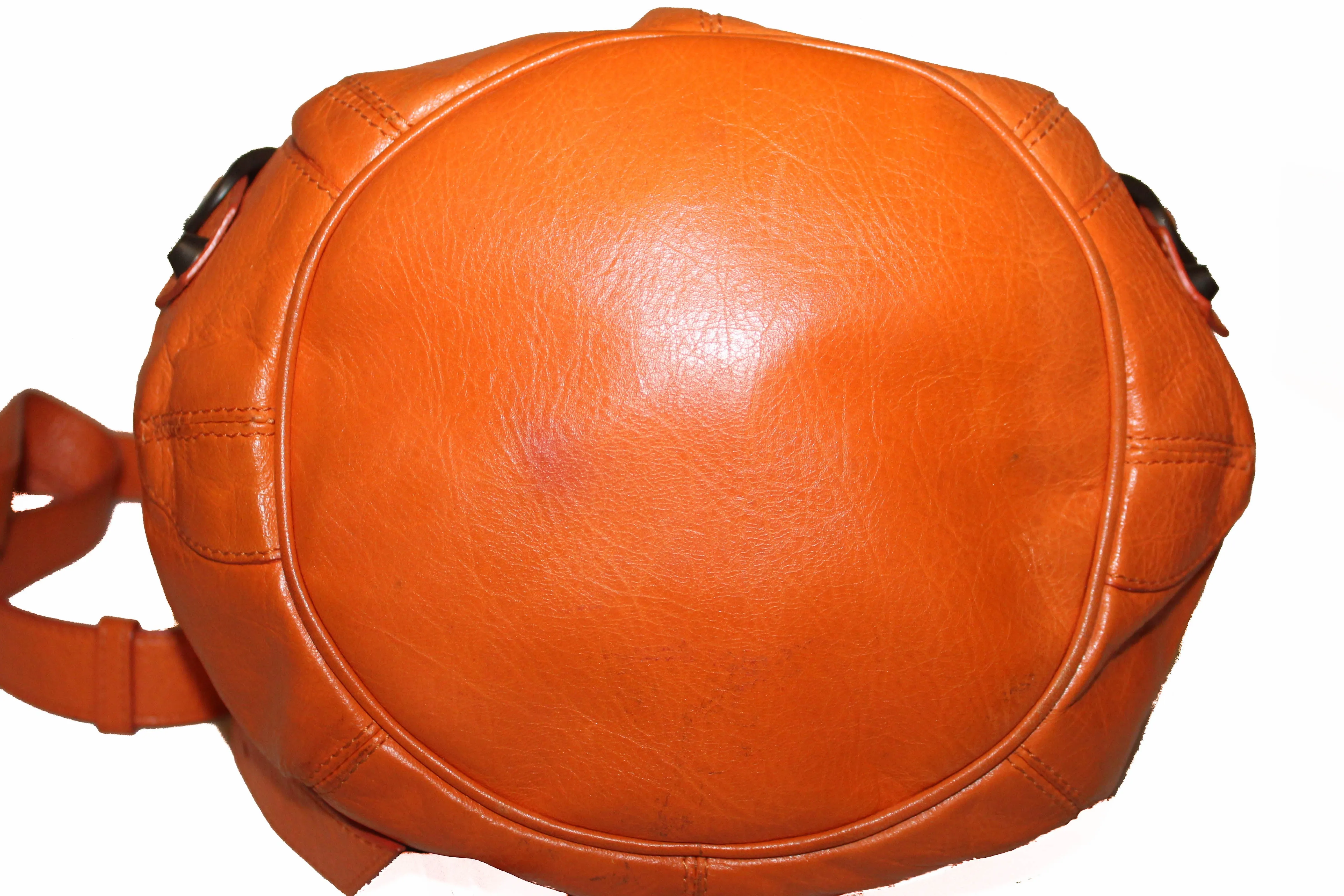 Authentic Balenciaga Orange Lambskin Leather Mini Pompon Bucket Crossbody