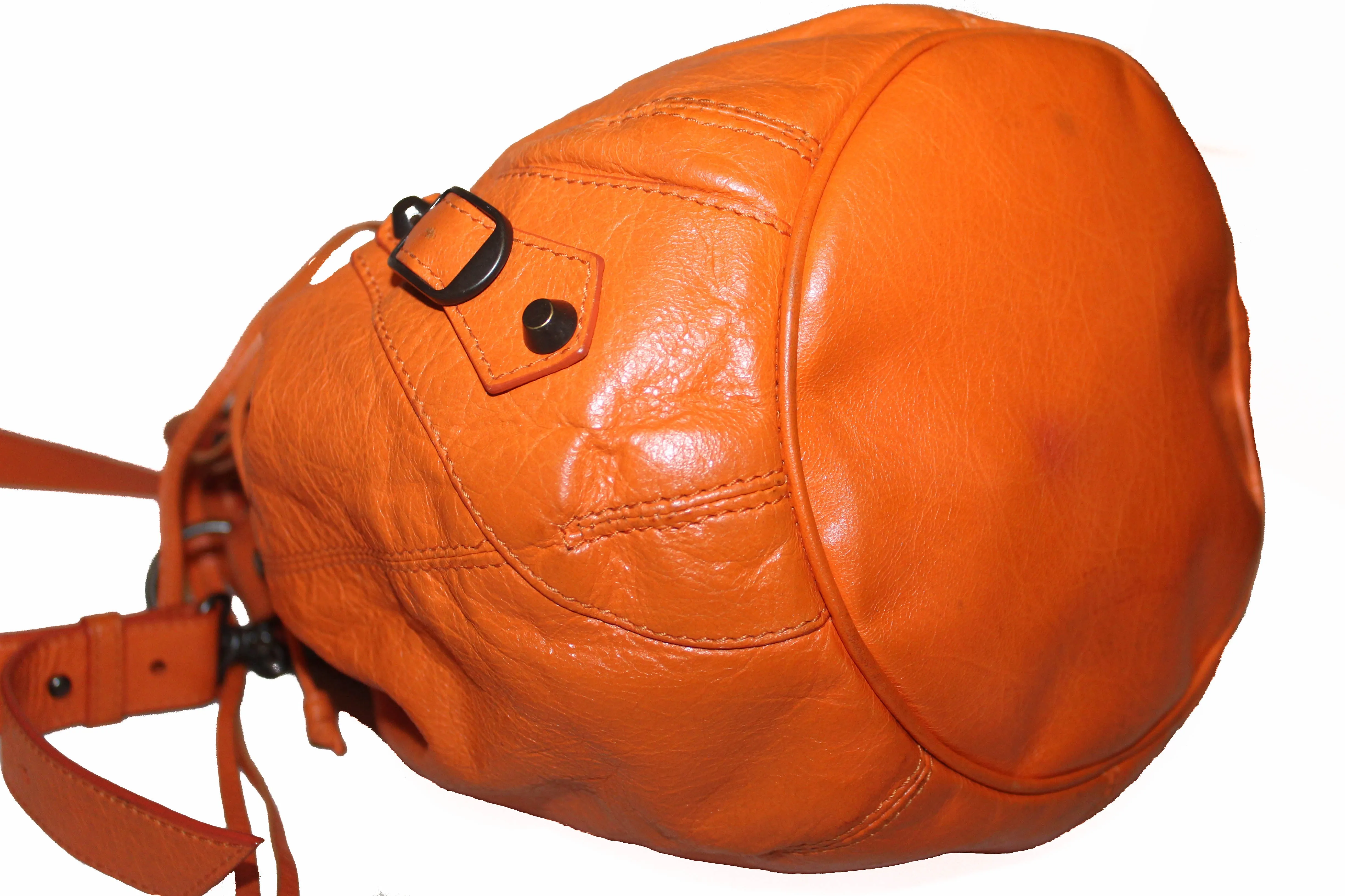 Authentic Balenciaga Orange Lambskin Leather Mini Pompon Bucket Crossbody
